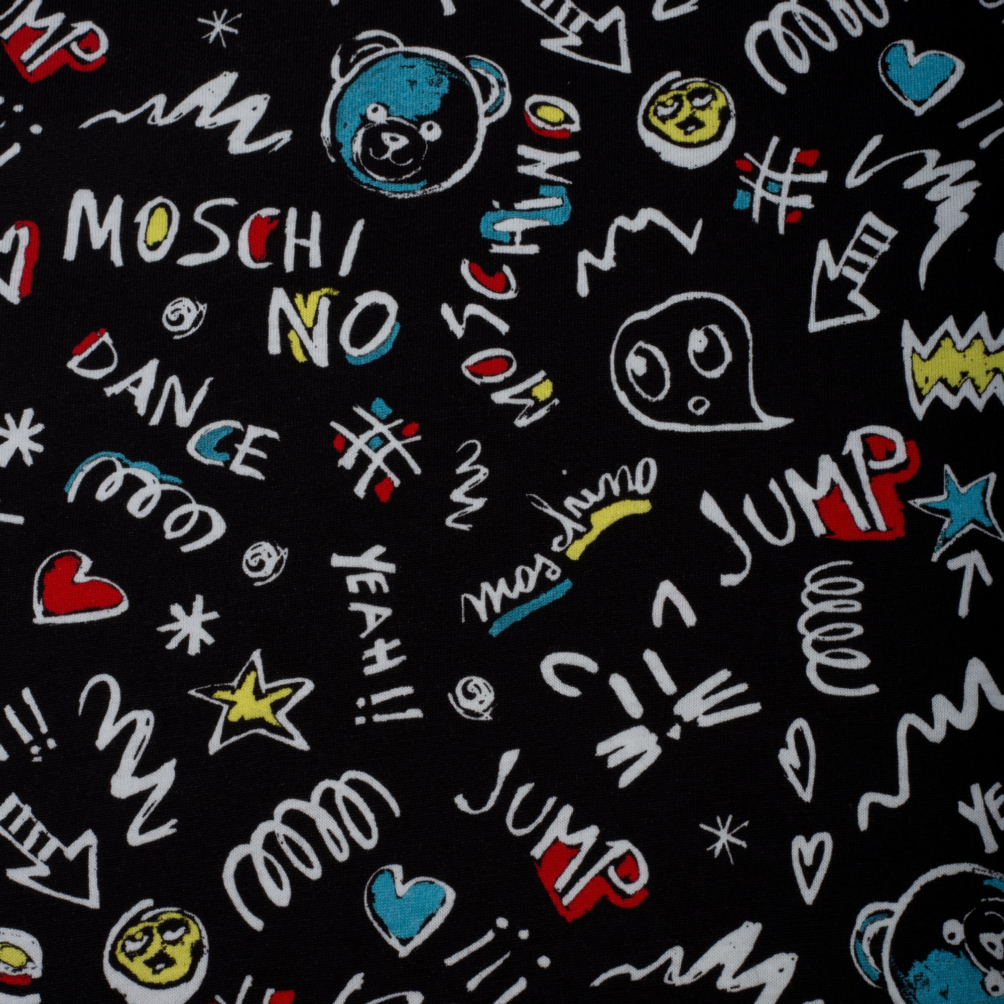 Patterned fabric with colorful text and graphics on a black background